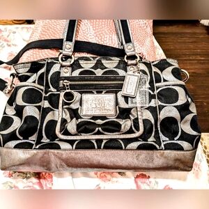 Black and metallic Coach handbag.